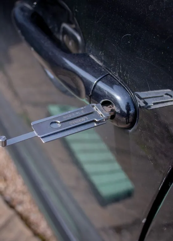 Lockout tool inserted into a car door to open it without damage